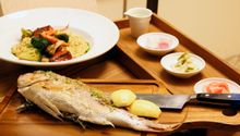 Catch of the Day Whole grilled fish with Peruvian seafood paella and pickles