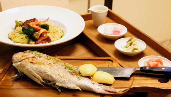 Catch of the Day Whole grilled fish with Peruvian seafood paella and pickles