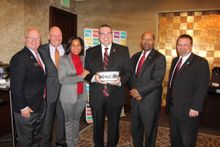 American Heart Association Director of Meetings Jason Ware (center) receives the Liberty Bowl, Philadelphia’s highest honor, fro