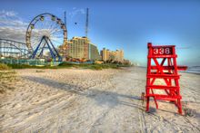 Lifeguard stand against the Daytona Beach Boardwalk & Pier backdrop