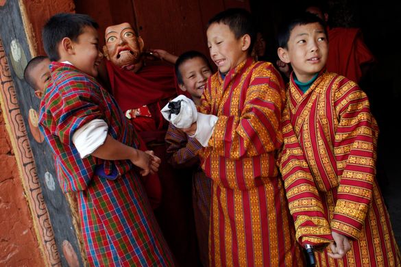 Bhutanese boys enjoying The Paro Tsechu Festiva, Bhutan