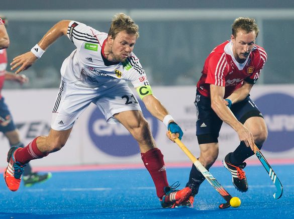 England Captain Barry Middleton challenges Germany's Captain Moritz Furste at the 2014 Champions Trophy. 