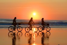 Sunrise bicycle riding on the beach