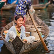 A Smiling local on a boat on Tonle Sap Lake in Cambodia 