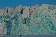 Swooshing past glaciers on snow mobile