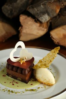 Bitter chocolate valentines heart gateau, mascarpone amaretto ice cream, peach compote, pistachio tuile
