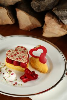 Raspberry mango valentines heart gateau, passion fruit sorbet, mixed berries, coconut malibu foam