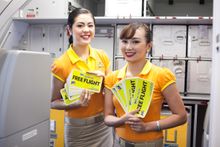 Cabin crew get ready to celebrate the milestone with the rest of the passengers