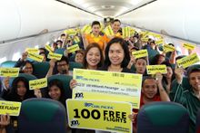 Cebu Pacific VP for Human Resources Rhea Villanueva, crew, passengers with Yelen Bontuyan, the airline’s 100 millionth passenger
