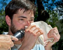 Michael Cox blows the same conch shell that his late father used to win the 1986 Conch Shell Blowing Contest in Key West, Fla. C
