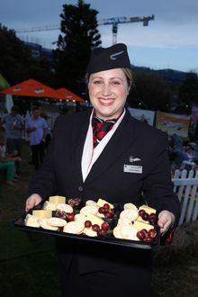 British Airways ambassador Hannah Wilson serves guests some of the new cheese selections as part of the premium cabin menu upgra