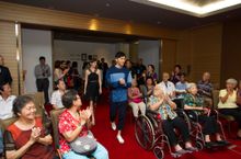Julian Cheung and Charmaine Sheh distribute CNY goodies to 20 seniors from AMKFSC COMNET Elderly Services