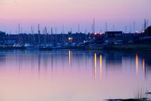 Yachts moored for the night in Amble Harbour