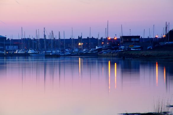 Yachts moored for the night in Amble Harbour