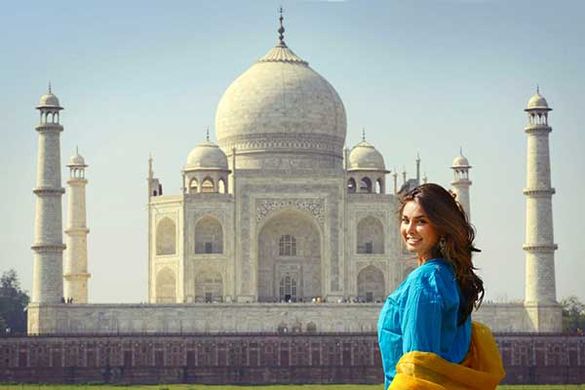 Lisa Ray with Insight Vacations in front of the Taj Mahal