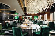 Main dining hall of Cuisine Cuisine at The Mira designed by Miami-based interior designer Charles Allem features contemporary ar