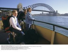 Three backpackers on ferry at Circular Quay, Sydney