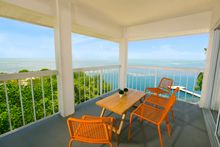 View from a guestroom balcony of the Atlantic Ocean at the newly restored Pelican Cove Resort and Marina