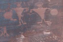 Petroglyphs are pecked into rock.