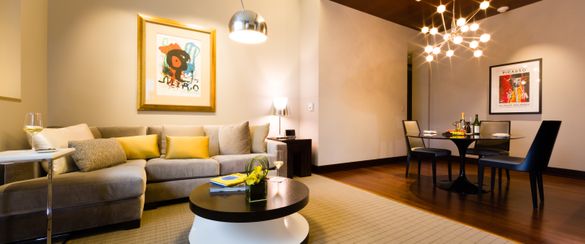 The living and dining area of the Modernism Suite in the Collection