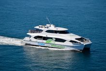 Cruise Whitsundays Kingfish vessel cruising through the Whitsunday Islands