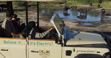 Electric game drive vechicle and tourists