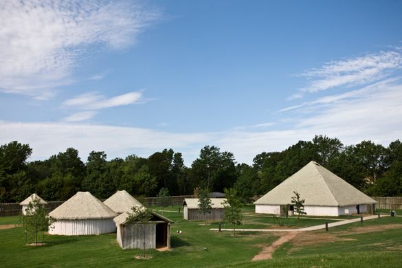 This photo showcases the traditional village at Chickasaw Cultural Center, located in Sulphur, Oklahoma. The Chikasha Inchokka' 
