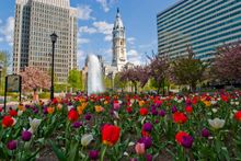A bronze statue of the city's founder William Penn stands atop the historic City Hall, located in the very center of the City of