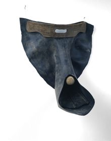 David Hammons, Putting on Sunday Manners, 1990; inner tube, chair back, flipper, tennis ball, nails, and wire; 32 x 24 x 16 1/2 