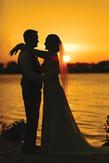 A couple embrace after their marriage at Hawks Cay Resort in Marathon.