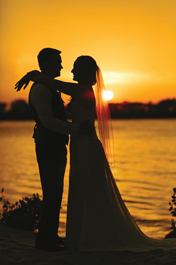 A couple embrace after their marriage at Hawks Cay Resort in Marathon.