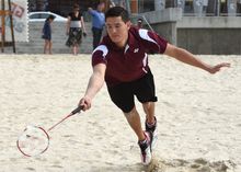 Queensland badminton champion Wesley Caulcutt practices badminton on the beach to mark the two year countdown until the Sudirman