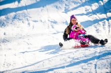 Go tobogganing at Corin Forest.