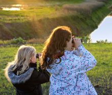 Girls with binoculars