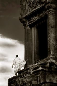 Monk at Angkor Temple by John McDermott 