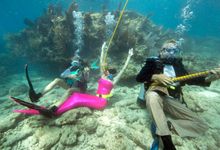 Participants pretend to play mock musical instruments and enjoy the Lower Keys Underwater Music Festival Saturday, July 12, 2014
