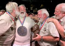 Wally Collins, second from left, is congratulated after beating 130 other men to be crowned the 2014 