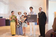 Warm welcome to Dusit Thani Guam Resort’s first guests: (second from left) Ms Mariko Azuma, Mrs Aki Maeda carrying Mr Atsuya Mae