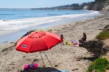 Family recently enjoying Haskell’s Beach in Goleta, down the coast from Refugio State Beach, which is set to reopen July 17. All