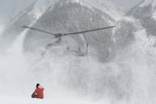 Mountain Guide Scott Belton waits for the heli