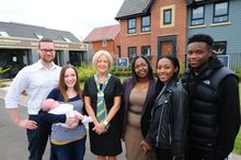 (L-R) Howard and Claire Blacksmith with baby Darcey, Barratt Homes Sales Adviser Fiona Santini and Elaine Harrison with her daug