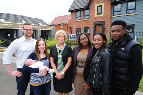 (L-R) Howard and Claire Blacksmith with baby Darcey, Barratt Homes Sales Adviser Fiona Santini and Elaine Harrison with her daug