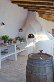 Learn to cook in the Gaudi inspired, wood fire pizza oven