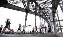 Runners cross the Sydney Harbour Bridge during Blackmores Sydney Running Festival 