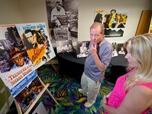 Stephen Bogart, left, son of Humphrey Bogart and the late Lauren Bacall, peruse posters and other memorabilia highlighting his f