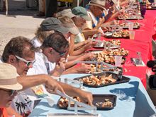 Contestants in the Keys Fisheries Stone Crab Eating Contest  crack claws and suck down their meat to determine the winner with t