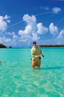 Justin Rea casts his fly rod while catch-and-release fishing in the sanctuary