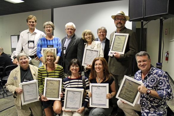 Lowell Thomas Travel Journalism Competition winners gather for a photo during the convention. Standing (left to right): Christop