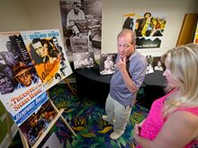 Stephen Bogart, left, son of Humphrey Bogart and Lauren Bacall, peruses posters and other memorabilia highlighting his father's 