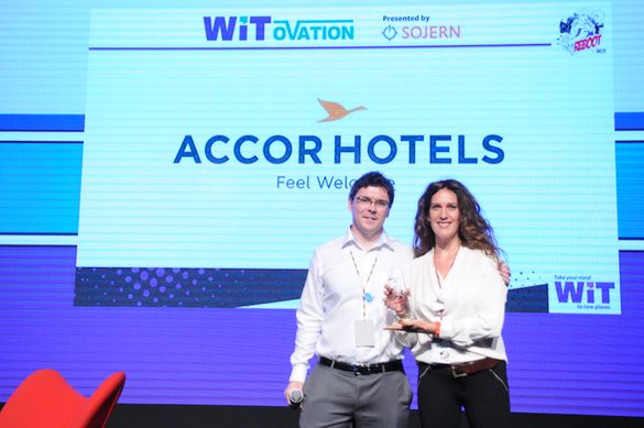 Stewart Hunter of Sojern presents the WIT Social Butterfly Award to Aline Massart, Regional Director of Digital Marketing, Upper